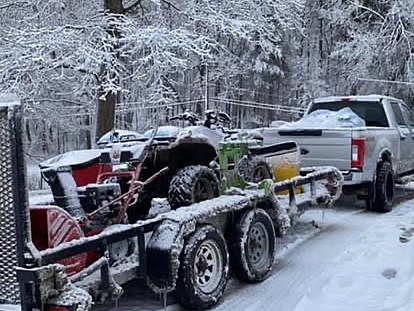 A truck and plow rig loaded for snow removal in winter, run by Cavalier Cleanup